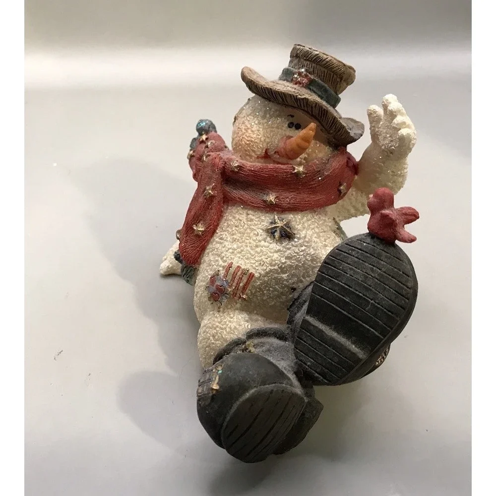 Resin Snowman Kicked‎ Back With A Bird On His Foot